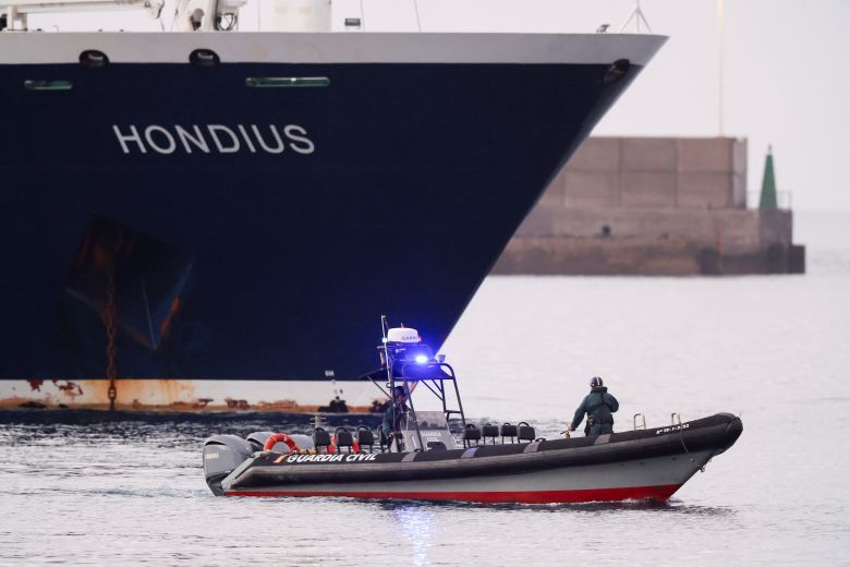A police boat approaches the cruise ship MV Hondius at the port of Granadilla de Abona after being affected by a hantavirus outbreak, in Tenerife, Spain, on May 10, 2026.