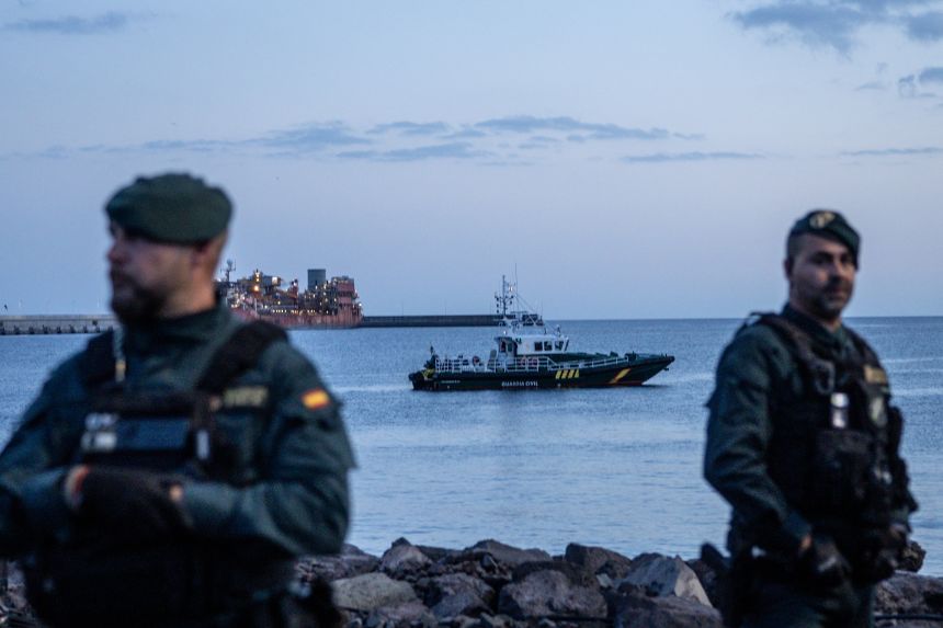 Members of Spain's Guardia Civil stand watch at the expected reception point for passengers from the MV Hondius at the Granadilla Port in Tenerife, on May 9, 2026.